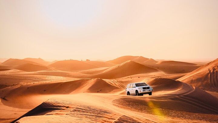 Abu Dhabi Evening Desert Safari: BBQ Dinner, Camel Ride & Shows