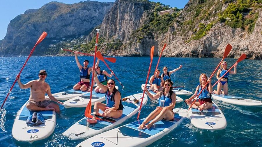 Paddleboard in Capri between caves and beaches. Photos included!