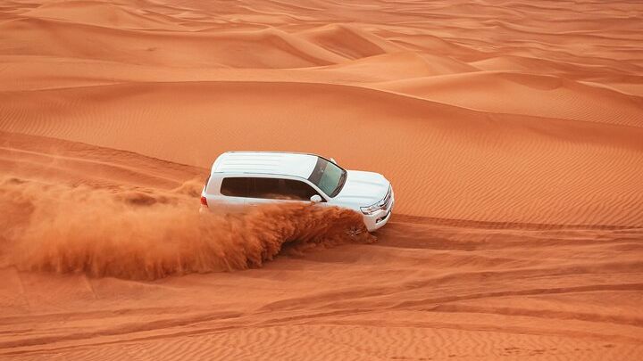 Dubai Desert Safari with Dune Bashing, Camel Ride & BBQ Dinner