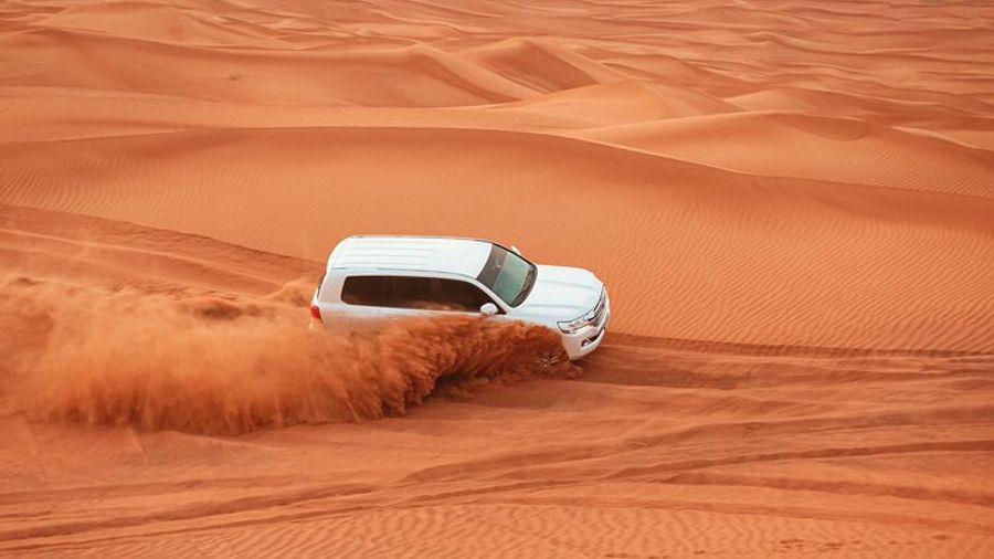 Dubai Desert Safari with Dune Bashing, Camel Ride & BBQ Dinner