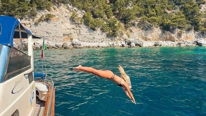 A half-day private swimming and snorkeling boat tour in Capri