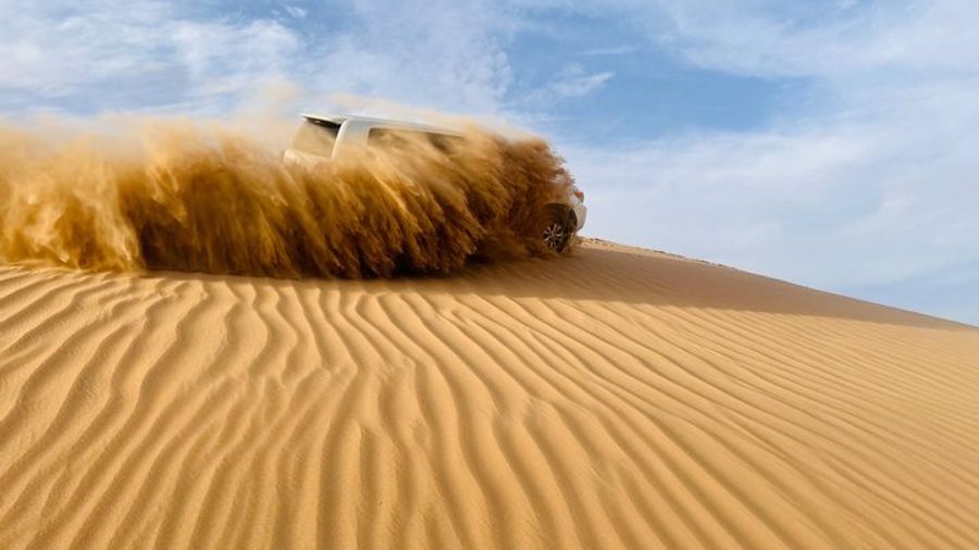 Abu Dhabi Morning Desert Safari with Camel Ride & Sandboarding