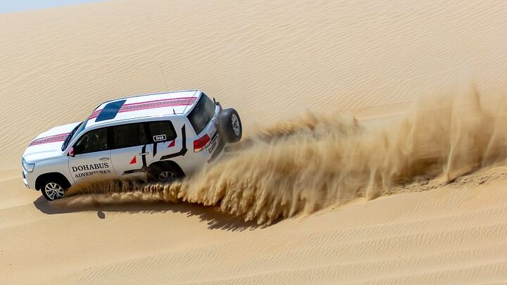 Full-day Qatar desert safari: dune bashing, sandboarding, camels